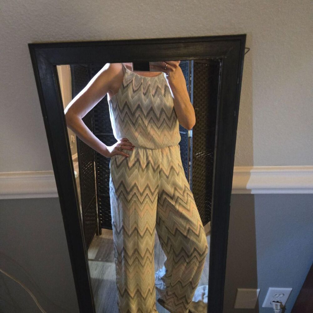 Jumpsuit by Tacera with a pink, gray, white,  and mint abstract chevron pattern